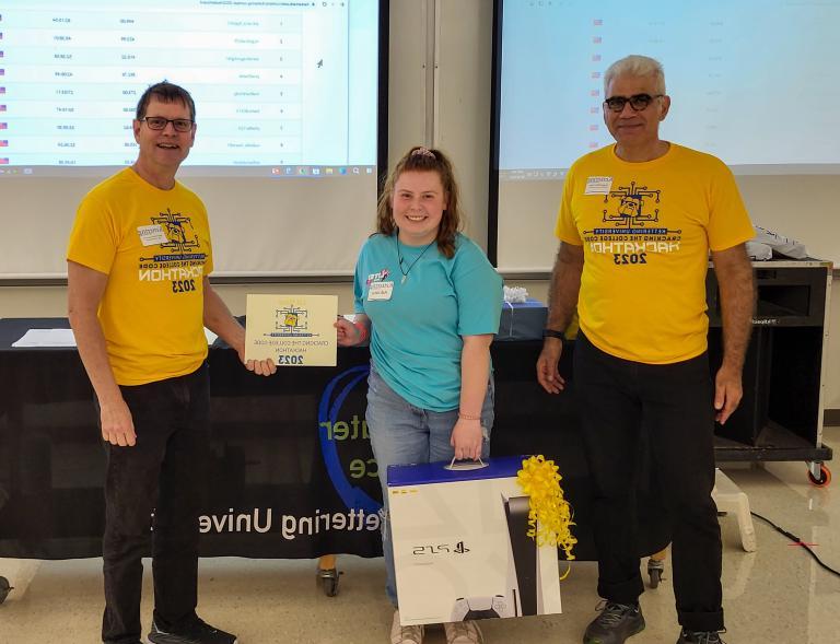 From left, Dr. Babak Elahi, Dean of the College of Sciences and Liberal Arts, Adriana Lippolis, first-place winner and Dr. Michael Farmer, Head of the Department of Computer Science at Kettering University.