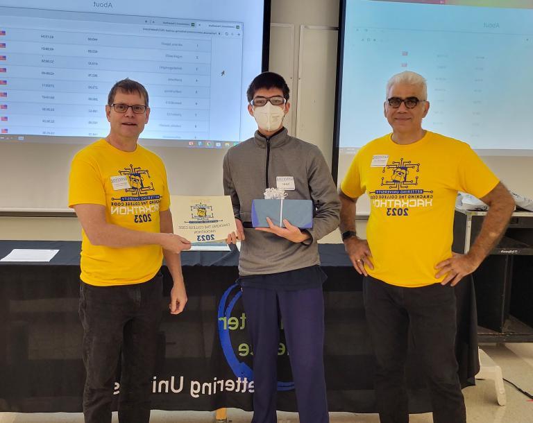 From left, Dr. Babak Elahi, Dean of the College of Sciences and Liberal Arts, Isaac Kellog, third-place winner and Dr. Michael Farmer, Head of the Department of Computer Science at Kettering University.